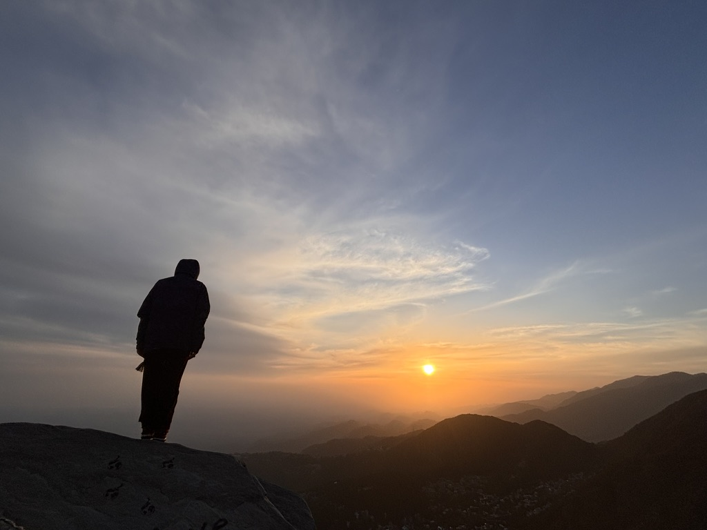 Watching sunset from a mountain summit, India